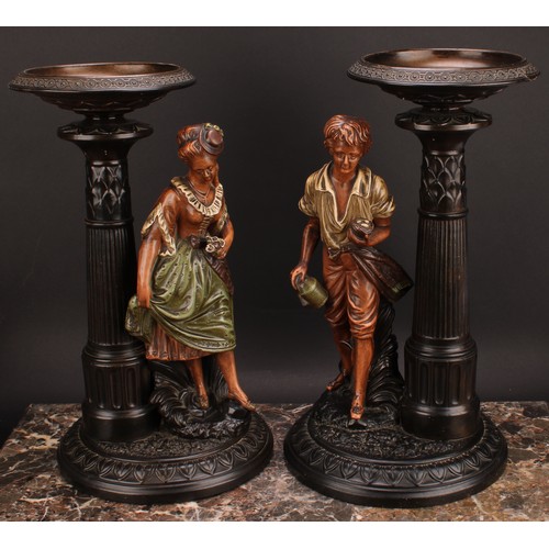 286 - A pair of Gerbing & Stephan figural table comports, each as a young gatherer, he with a basket of eg... 