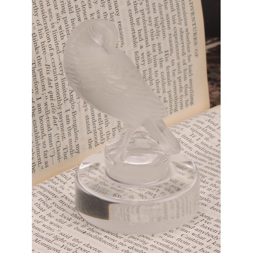 300 - A Lalique frosted glass place card holder, modelled as a turtle dove preening, circular base, engrav... 