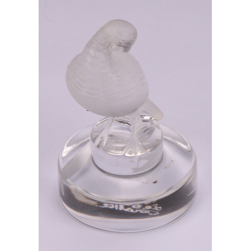 300 - A Lalique frosted glass place card holder, modelled as a turtle dove preening, circular base, engrav... 