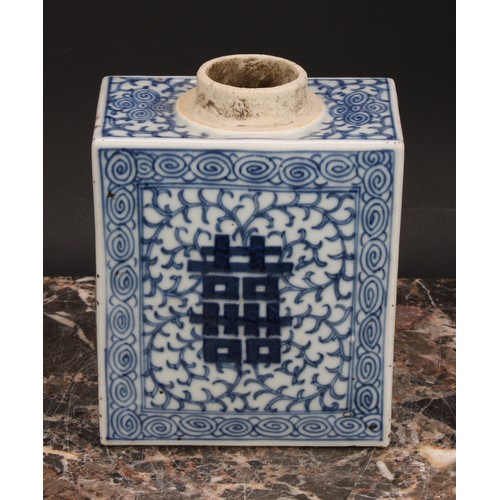 321 - A Chinese canted rectangular tea caddy, painted in tones of underglaze blue with flowers and leafy b... 