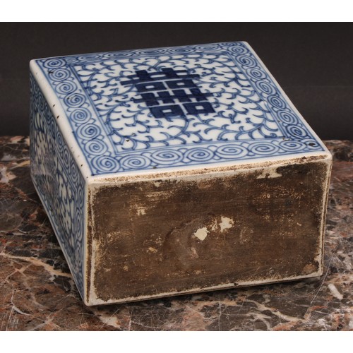 321 - A Chinese canted rectangular tea caddy, painted in tones of underglaze blue with flowers and leafy b... 