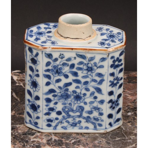 321 - A Chinese canted rectangular tea caddy, painted in tones of underglaze blue with flowers and leafy b... 