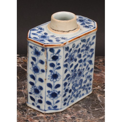 321 - A Chinese canted rectangular tea caddy, painted in tones of underglaze blue with flowers and leafy b... 