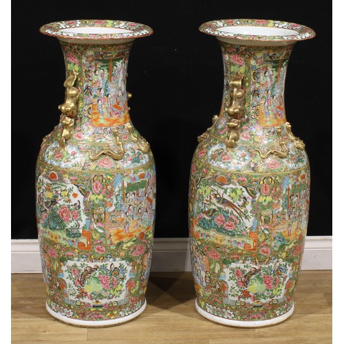 372 - A pair of large Chinese famille rose floor vases, painted in the Cantonese taste with a profusion of... 