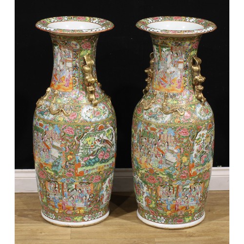 372 - A pair of large Chinese famille rose floor vases, painted in the Cantonese taste with a profusion of... 