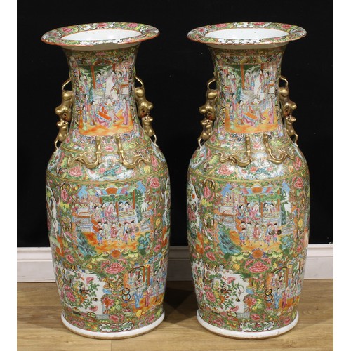 372 - A pair of large Chinese famille rose floor vases, painted in the Cantonese taste with a profusion of... 