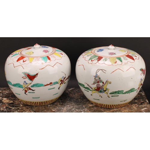 368 - A pair of Chinese ovoid ginger jars and covers, decorated in polychrome with figures in battle, four... 