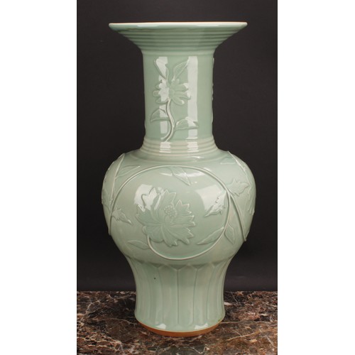 366 - A large Chinese celadon baluster vase, moulded with lotus, 53cm high, seal mark, hardwood stand