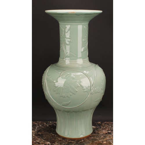 366 - A large Chinese celadon baluster vase, moulded with lotus, 53cm high, seal mark, hardwood stand