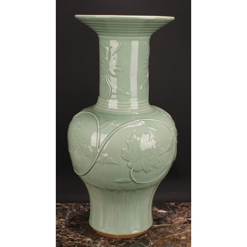 366 - A large Chinese celadon baluster vase, moulded with lotus, 53cm high, seal mark, hardwood stand