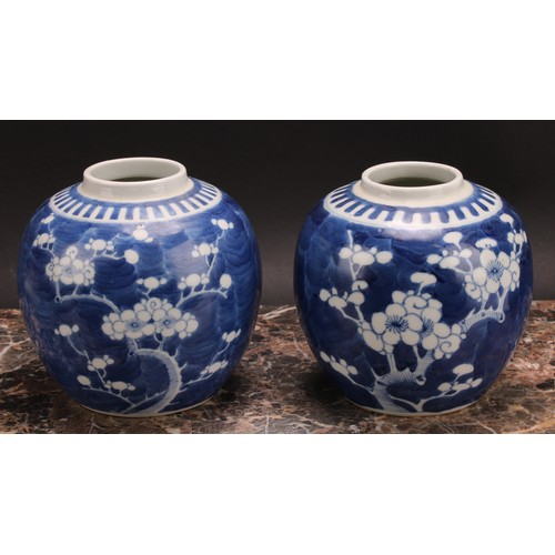 326 - A Chinese ovoid ginger jar, painted in tones of underglaze blue with blossoming prunus on a ground o... 