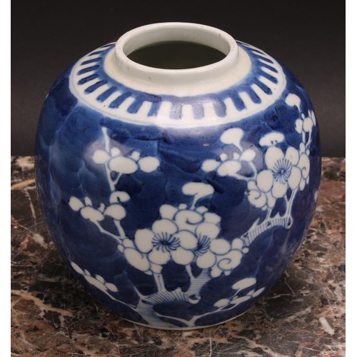 326 - A Chinese ovoid ginger jar, painted in tones of underglaze blue with blossoming prunus on a ground o... 