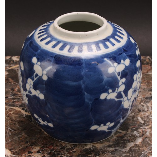 326 - A Chinese ovoid ginger jar, painted in tones of underglaze blue with blossoming prunus on a ground o... 