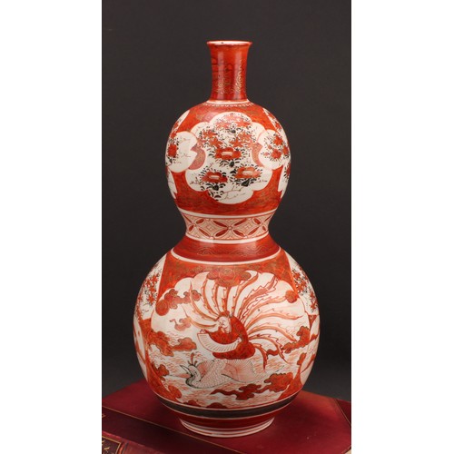 352 - A Japanese Kutani double gourd vase, painted in the typical palette with a deity seated on a phoenix... 