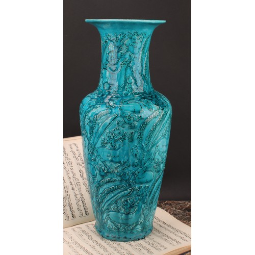 327 - A Chinese ovoid vase, glazed in turquoise, moulded in the Archaic manner, with stylised deer and rab... 