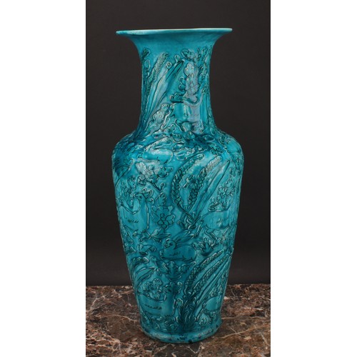 327 - A Chinese ovoid vase, glazed in turquoise, moulded in the Archaic manner, with stylised deer and rab... 