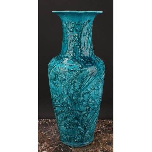 327 - A Chinese ovoid vase, glazed in turquoise, moulded in the Archaic manner, with stylised deer and rab... 