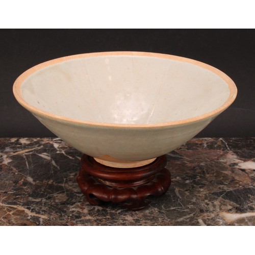 347 - A Chinese Sung type celadon circular bowl, the centre moulded with lotus flower, 17cm diameter, 19th... 