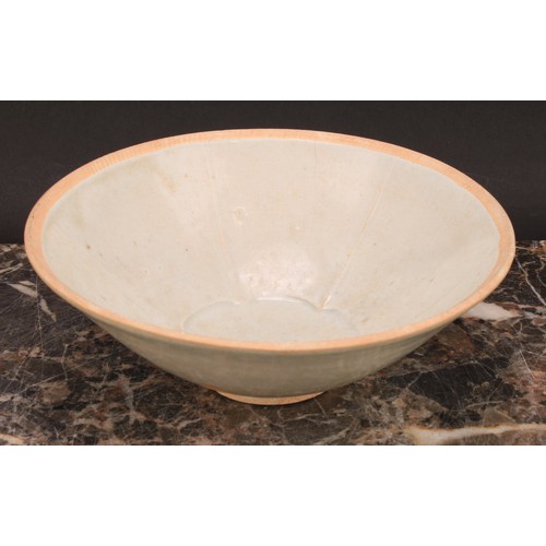 347 - A Chinese Sung type celadon circular bowl, the centre moulded with lotus flower, 17cm diameter, 19th... 