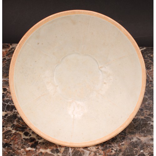 347 - A Chinese Sung type celadon circular bowl, the centre moulded with lotus flower, 17cm diameter, 19th... 