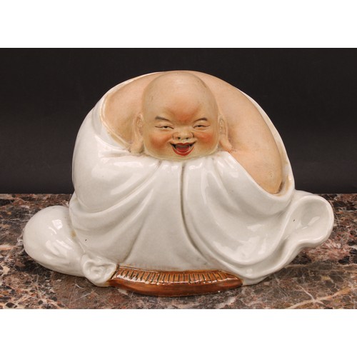 328 - A Chinese pottery figure, of Budai, seated, 19cm high