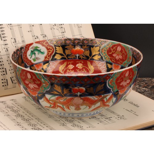 355 - A Japanese porcelain bowl, decorated in the Imari palette, 25cm diameter, Meiji period