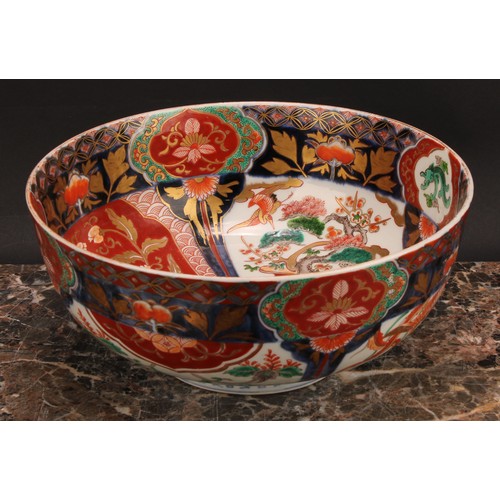 355 - A Japanese porcelain bowl, decorated in the Imari palette, 25cm diameter, Meiji period