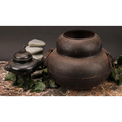 343 - A Japanese bronze tripod koro, 14cm high; a Japanese cast iron chagama, 17cm high (2)