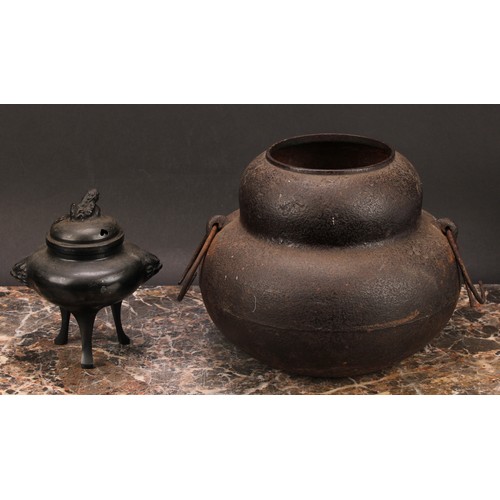 343 - A Japanese bronze tripod koro, 14cm high; a Japanese cast iron chagama, 17cm high (2)