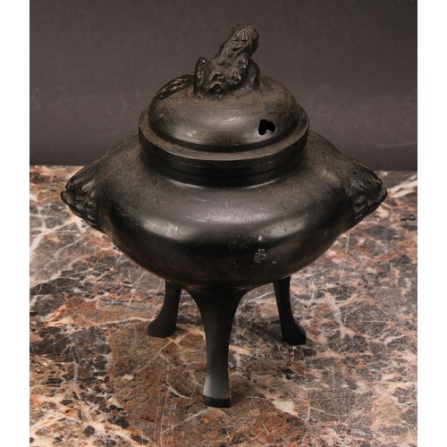 343 - A Japanese bronze tripod koro, 14cm high; a Japanese cast iron chagama, 17cm high (2)