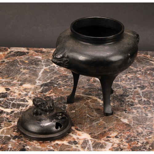 343 - A Japanese bronze tripod koro, 14cm high; a Japanese cast iron chagama, 17cm high (2)