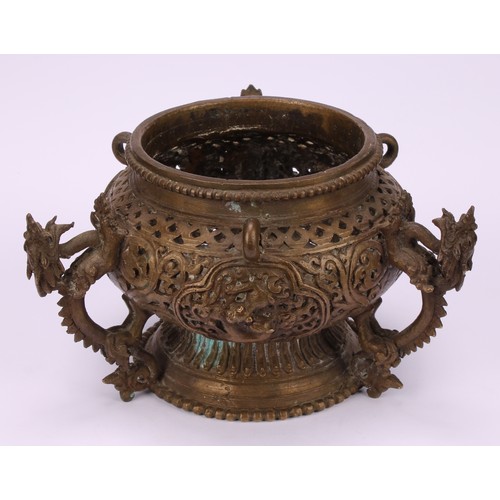 331 - A Chinese bronze hanging censer, pierced and cast with dragons, temple lions and scrolls, 18.5cm dia... 