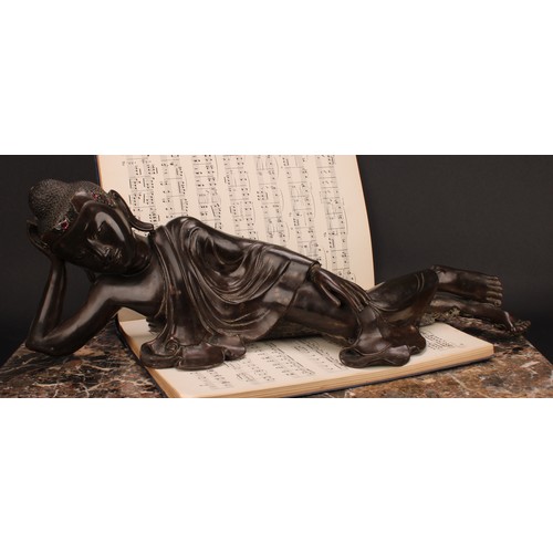 345 - Chinese School, a brown patinated bronze, Buddha, depicted reclining, about to enter Parinirvana, hi... 