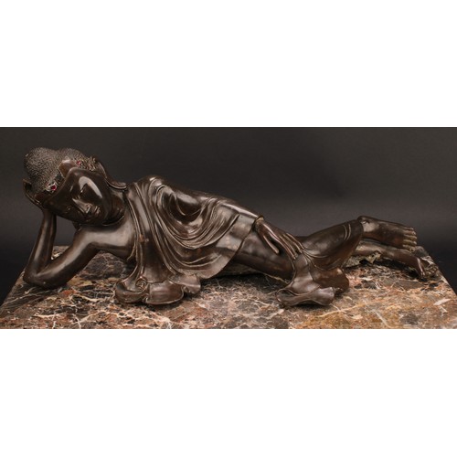 345 - Chinese School, a brown patinated bronze, Buddha, depicted reclining, about to enter Parinirvana, hi... 