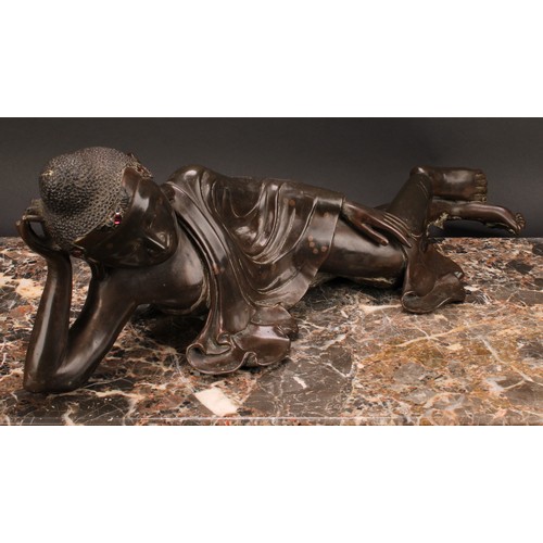 345 - Chinese School, a brown patinated bronze, Buddha, depicted reclining, about to enter Parinirvana, hi... 