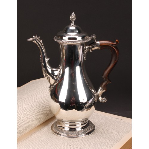 795 - A George III silver baluster coffee pot, quite plain, hinged domed cover with wrythen finial, scroll... 