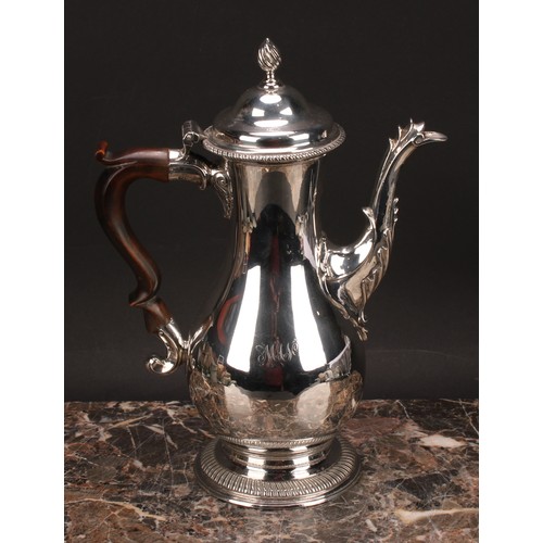 795 - A George III silver baluster coffee pot, quite plain, hinged domed cover with wrythen finial, scroll... 