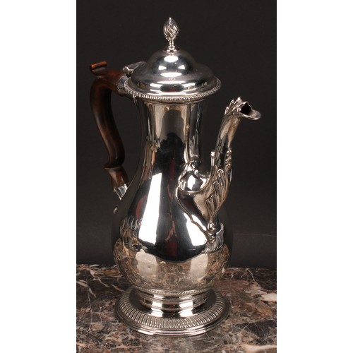 795 - A George III silver baluster coffee pot, quite plain, hinged domed cover with wrythen finial, scroll... 