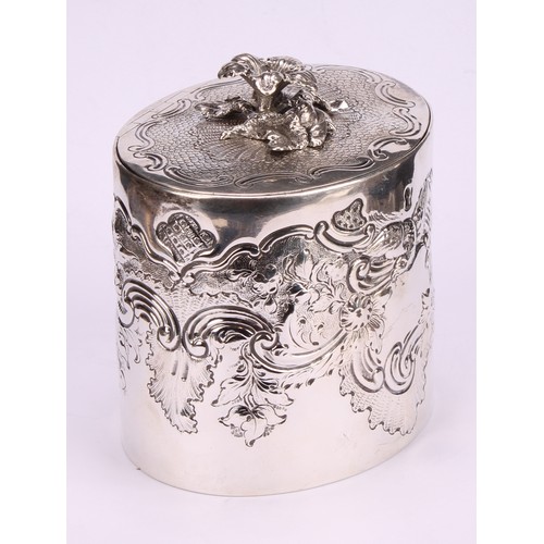 792 - A George III oval tea caddy, chased with birds, flowers and scrolling leaves, flush-hinged cover wit... 