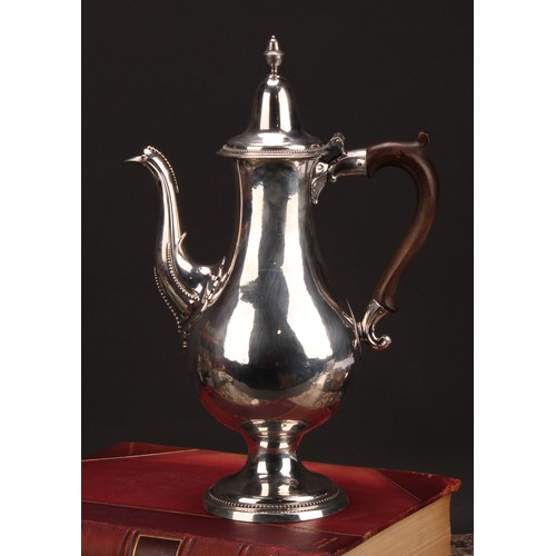 793 - A George III provincial silver baluster coffee pot, hinged lofty domed cover with acorn finial, scro... 