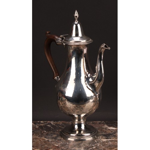 793 - A George III provincial silver baluster coffee pot, hinged lofty domed cover with acorn finial, scro... 