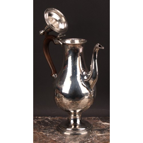 793 - A George III provincial silver baluster coffee pot, hinged lofty domed cover with acorn finial, scro... 