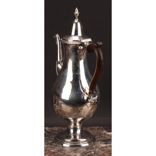 793 - A George III provincial silver baluster coffee pot, hinged lofty domed cover with acorn finial, scro... 