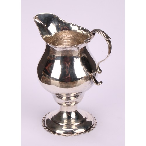 796 - A George III silver baluster cream jug, acanthus-capped scroll handle, crimped borders, 11cm high, L... 