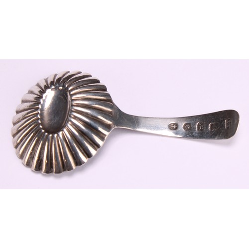 800 - A George III silver caddy spoon, fluted circular bowl, bright-cut and wrigglework engraved stem, 7cm... 