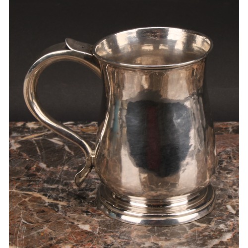 791 - A George II West Country provincial silver bell shaped beer mug, scroll handle, skirted base, 12cm h... 