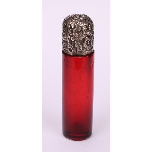 1255 - A 19th century silver coloured metal mounted cylindrical cranberry glass scent bottle, the hinged co... 