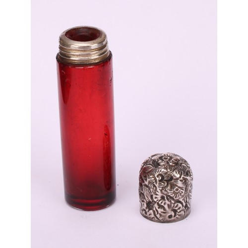 1255 - A 19th century silver coloured metal mounted cylindrical cranberry glass scent bottle, the hinged co... 