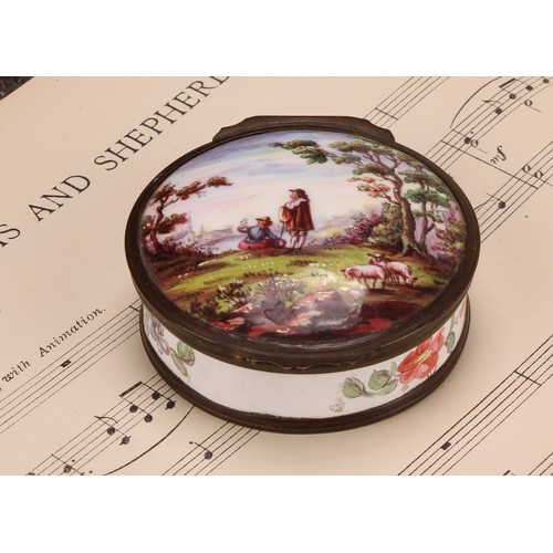 1249 - A 19th century enamel circular table snuff box, hinged cover painted with young shepherds in a pasto... 