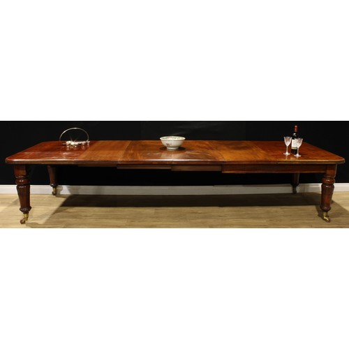 2169 - A William IV mahogany extending dining table, rounded rectangular top, four additional leaves, turne... 